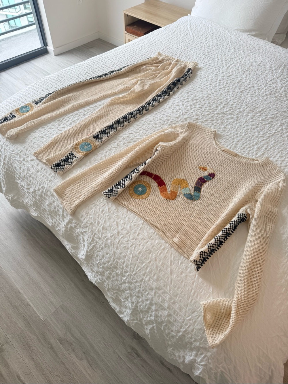 La Troupe Cream Knit Top with Colorful Snake Motif